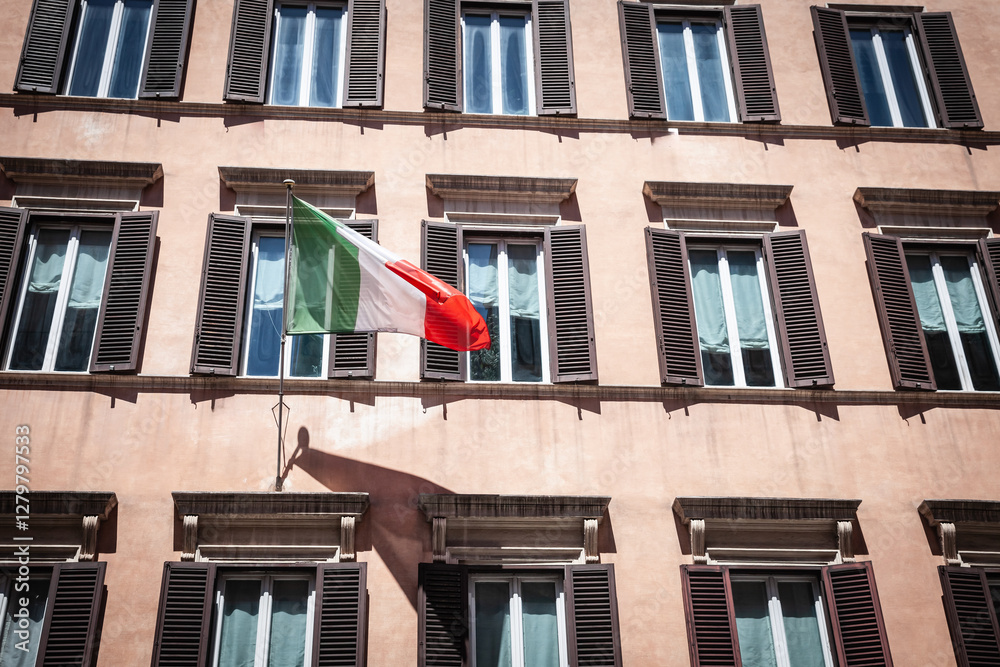 Φωτογραφία An Italian flag waves from a pastel facade with classic shutters, reflecting national pride and hinting at the city’s rich real estate character in Rome, italy
