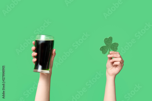 Hands with beer and clover ...