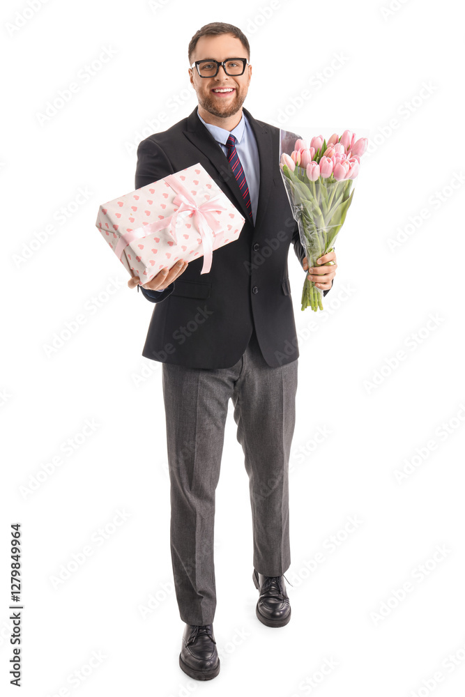Handsome businessman with tulips and gift box on white background. International Women's Day celebration Handsome businessman with tulips and gift box on white background. International Women's Day celebration
