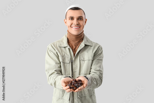 Young Muslim man with dates...