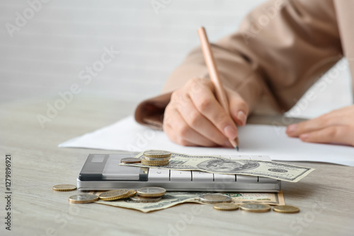 Calculator with money on ta...