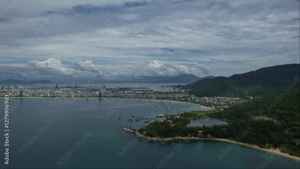 Ocean surrounded by mountains, with a picturesque horizon and cloudy sky 4K view Da Nang Vietnam Ocean surrounded by mountains, with a picturesque horizon and cloudy sky 4K view Da Nang Vietnam