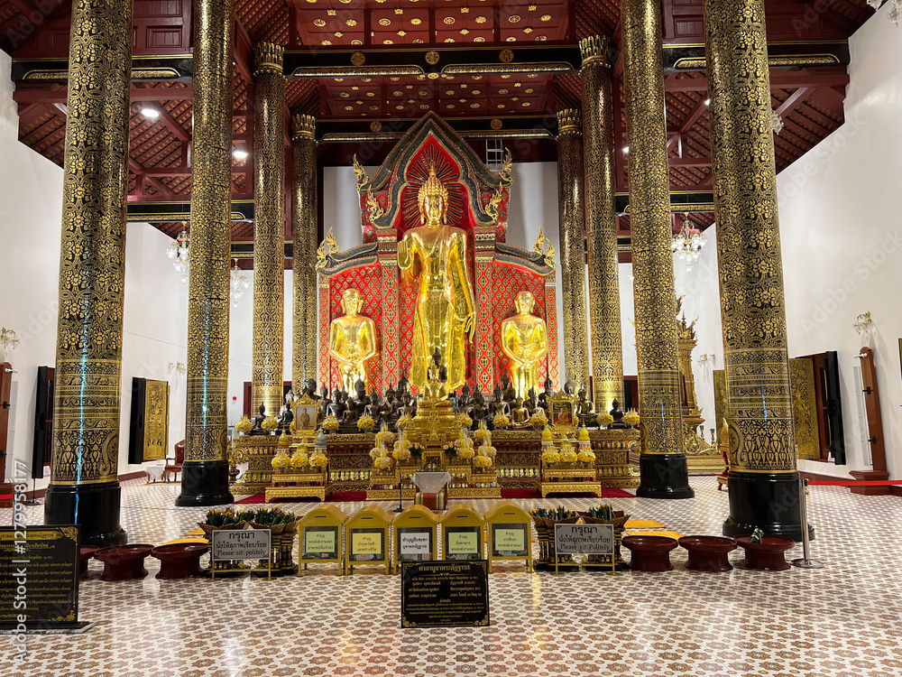 Buddha statue at Wat Chedi Luang Buddhist temple at night in Chiang Mai
