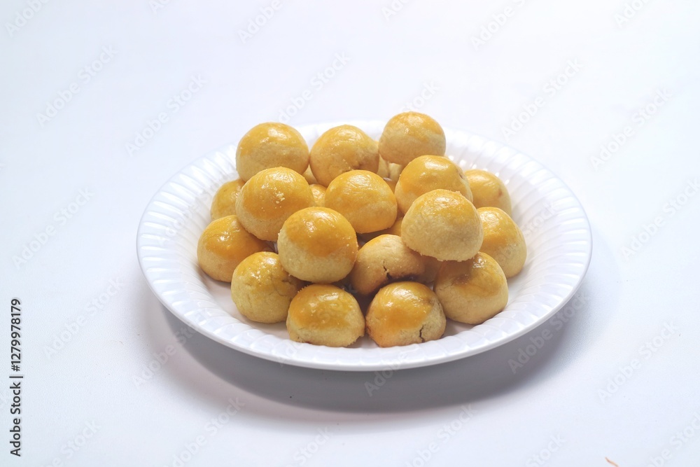 pineapple tart or nanas tart or nastar cookies. cookies with pineapple jam inside on bright mood pineapple tart or nanas tart or nastar cookies. cookies with pineapple jam inside on bright mood