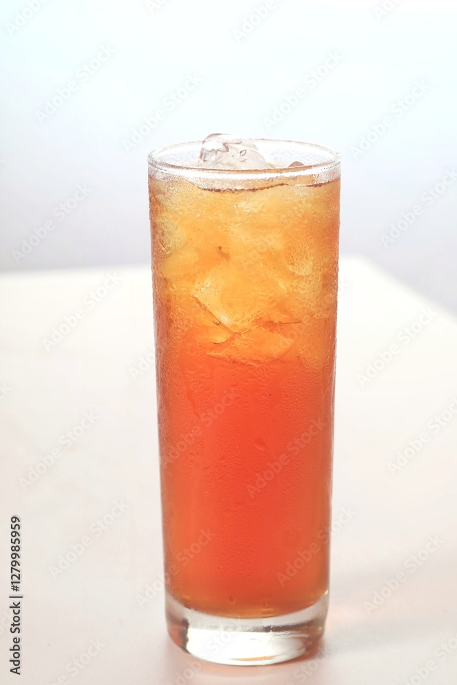 a glass of ice tea isolated on white background
a glass of ice tea isolated on white background