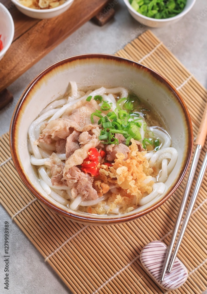 Japanese traditional noodle soup Niku Udon with kakedashi soup, fish stock soup and then topped with sliced beef and sliced scallions.
Japanese traditional noodle soup Niku Udon with kakedashi soup, fish stock soup and then topped with sliced beef and sliced scallions.