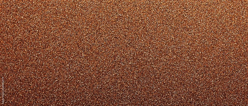 Shimmering bronze sandpaper texture for creative backgrounds and designs. Shimmering bronze sandpaper texture for creative backgrounds and designs.