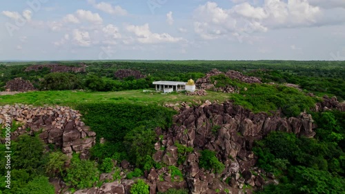 Sri rama Temple in the hill top with greenery, sky and clouds at yelupugonda village, Tekmal, telangana, india. day time, push in, drone shot, 4k. photo