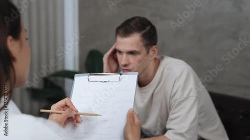 Psychological consultation gaining improvement on mental problem, young patient doing therapy session while psychiatrist making diagnostic on mental illness. Mental treatment session. Adit