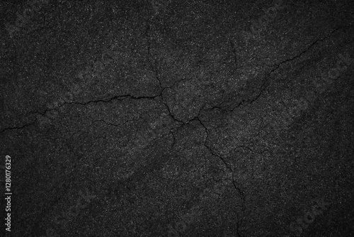 Crack background texture of rough asphalt top view.