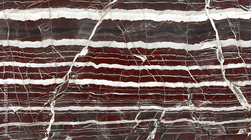Obraz na płótnie A close-up view of a polished stone surface featuring red and white striped patterns. w salonie