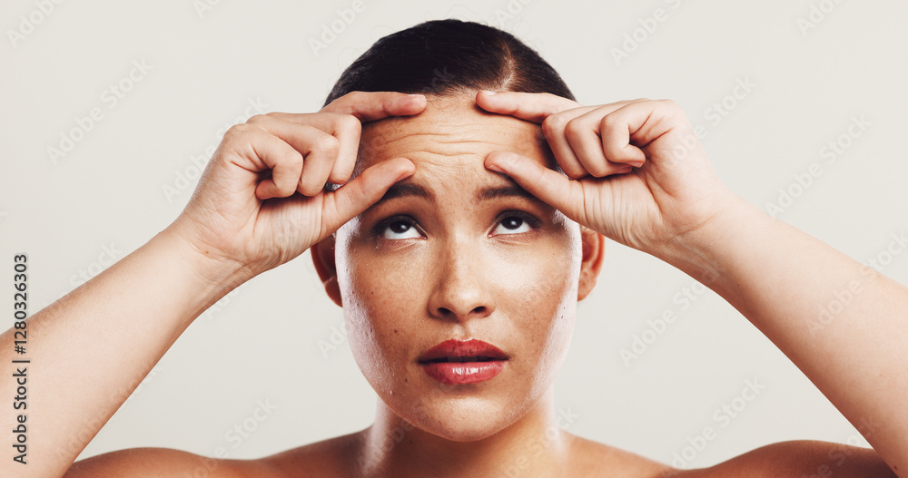 Naklejka premium Wrinkles, forehead and woman with skincare, beauty and plastic surgery on white studio background. Person, worry and model with cosmetic facial filler, wellness and health with dermatology and stress