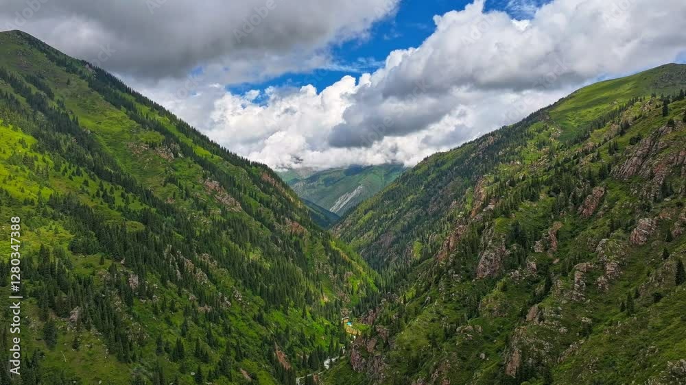 green mountain slopes with white clouds on blue sky above, drone hyperlapse green mountain slopes with white clouds on blue sky above, drone hyperlapse