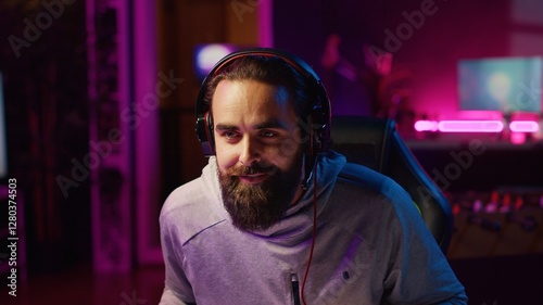 Man recording himself competing in videogame tournaments online while streaming on internet channels for viewers. Pro gamer participating in esports tourney during livestream with audience