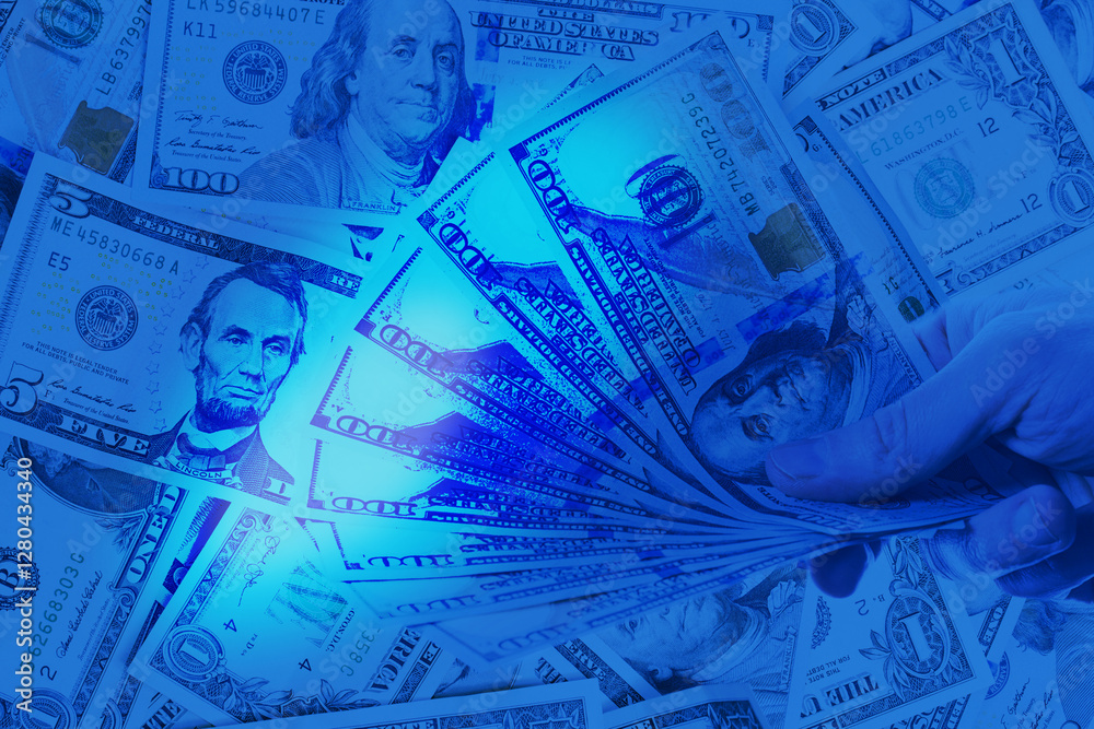 Fototapeta premium US Dollar cash money in uv light on blue background