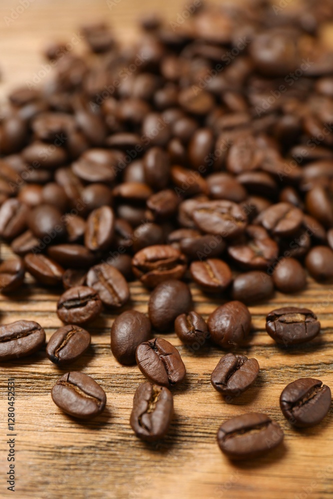 Fresh coffee beans on wooden background Fresh coffee beans on wooden background