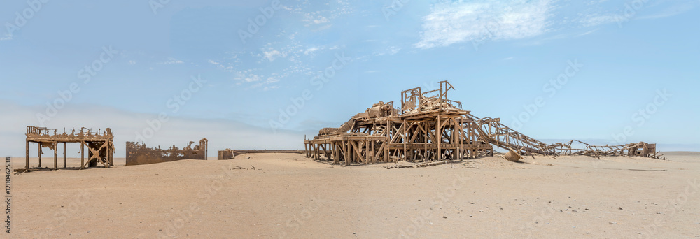 historical Drill Rig relic on desert sand, Old oil Rig site, Skeleton coast, Namibia