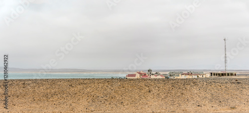 Obraz na płótnie touristic buildings on Ocean bay shore, Cape Cross, Namibia w salonie