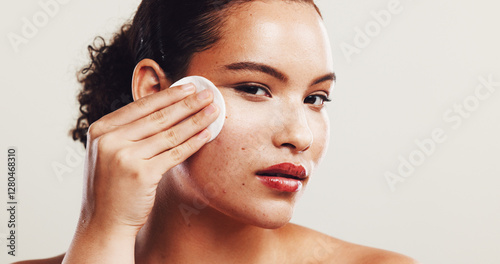 Portrait, cotton pad and woman with cosmetics, dermatology and clean on white studio background. Face, person and model with aesthetic, beauty and cleanser with skincare, wellness and remove makeup