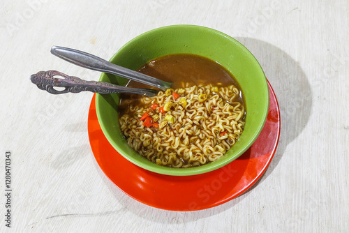 Instant water noodles in a bowl on the table ready to eat
