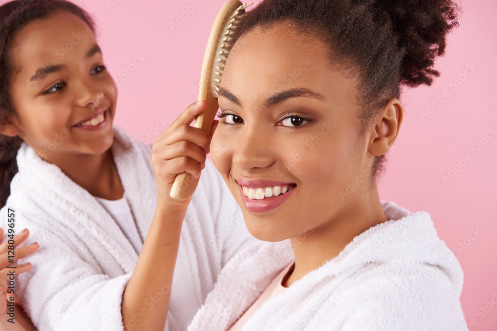Close up. Little African American girl is combing Close up. Little African American girl is combing