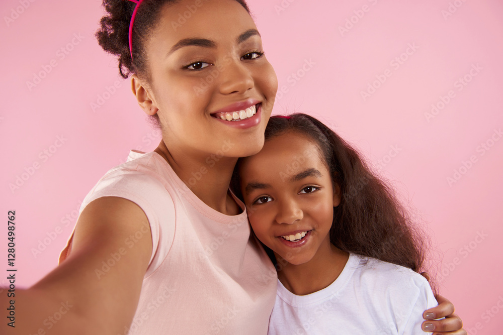 Afro American mother and daughter in sham crowns Afro American mother and daughter in sham crowns