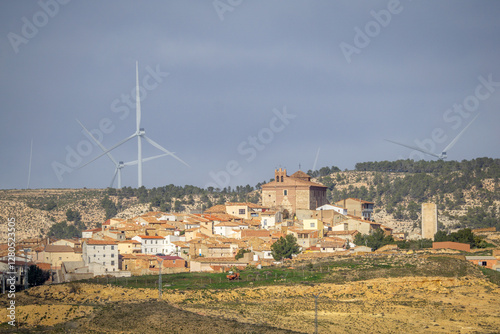 View of Alacon Village and Wind Turbines from Afar in Teruel