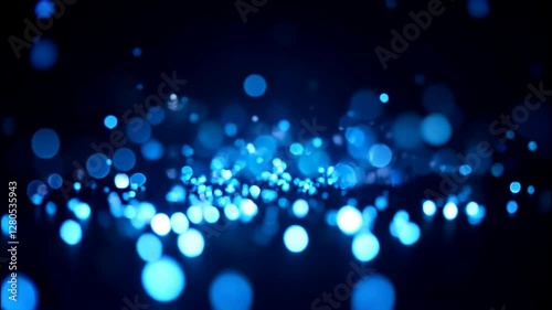 Glowing Blue Particles on a Dark Background Creating an Enchanting Atmosphere