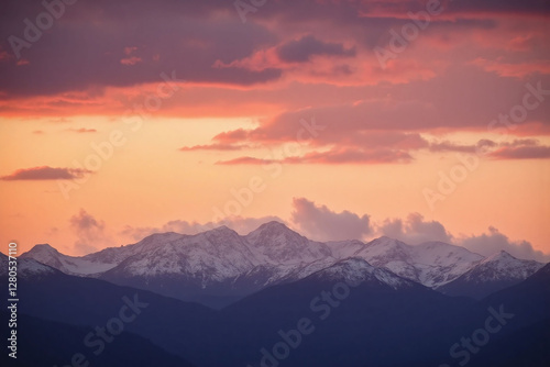 Landscape photograph of mountain range with sunset sky