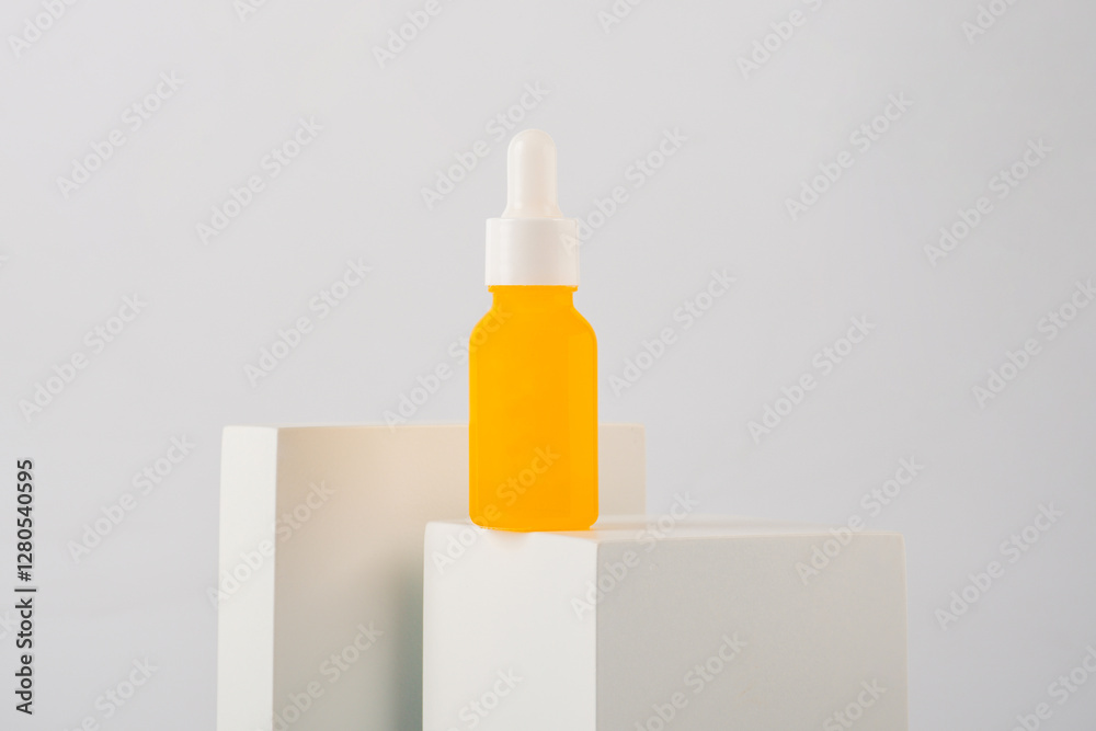 Plastic yellow tube for cream or lotion. Skin care or sunscreen cosmetic with stylish props on white background. Plastic yellow tube for cream or lotion. Skin care or sunscreen cosmetic with stylish props on white background.