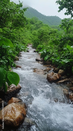 Serene Winding River Flows Through Lush Green Landscape Surrounded by Vibrant...