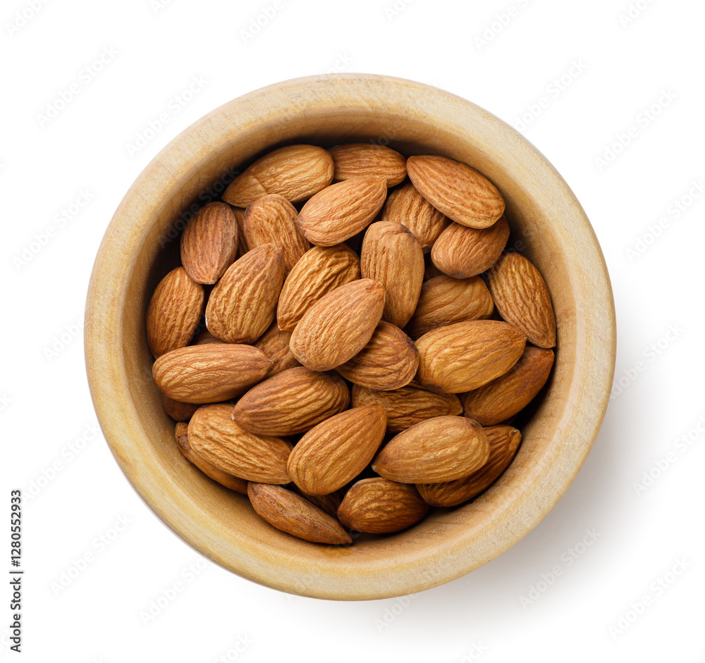 Almond nuts in a wooden plate on a white background. Top view Almond nuts in a wooden plate on a white background. Top view