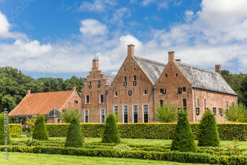 Obraz na płótnie Shaped trees in the garden of the Menkemaborg mansion in Groningen, Netherlands w salonie