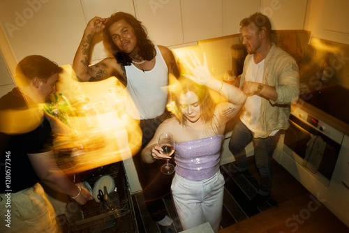 Group of friends enjoying party at home photo