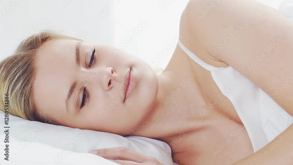 Peaceful, serene scene of a young woman sleeping comfortably in bed, with soft, natural lighting. Perfect for themes of relaxation, rest, and tranquility. Peaceful, serene scene of a young woman sleeping comfortably in bed, with soft, natural lighting. Perfect for themes of relaxation, rest, and tranquility.