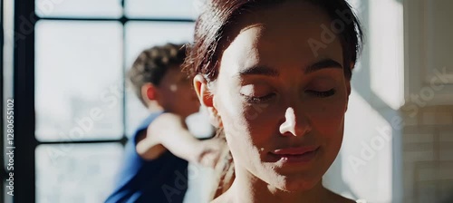 Mom finds peace and meditation amid joyful chaos in sunlit kitchen