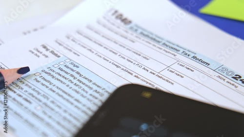 Accountant preparing tax form 1040 for tax season 2025