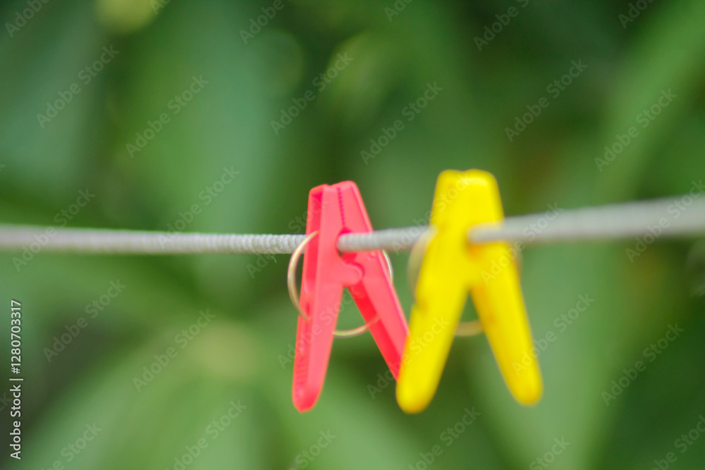 Colorful plastic clothespins on metal string
Colorful plastic clothespins on metal string