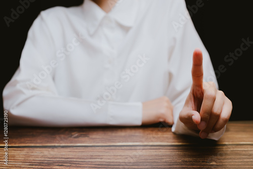 Hand Gesture of Warning or Attention with Focused Background photo