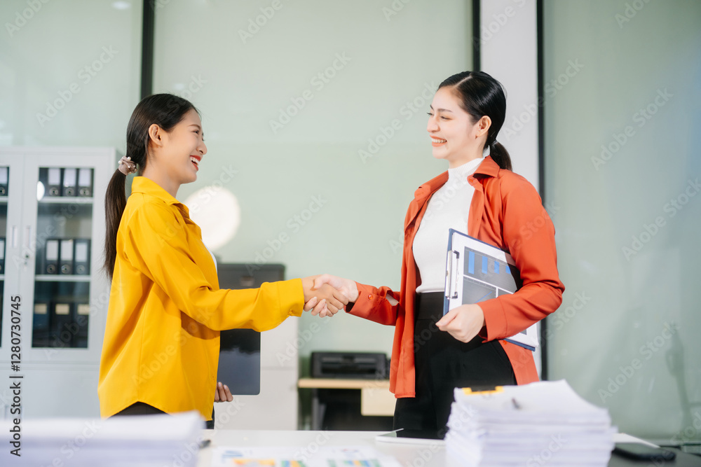 Business partnership handshake concept.Photo two coworkers handshaking process. Business partnership handshake concept.Photo two coworkers handshaking process.