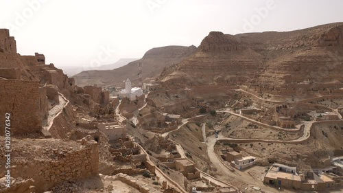 Panoramic overview of beautiful Berber village of Chenini, located on a rugged mountain ridge in Tunisia
