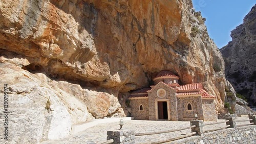 Nestled within the towering rock face of Kotsifou Gorge, the Saint Nicholas Chapel stands as a serene, stone-built refuge.