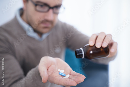 Tableau sur toile One man taking painkillers to relieve pain and headache