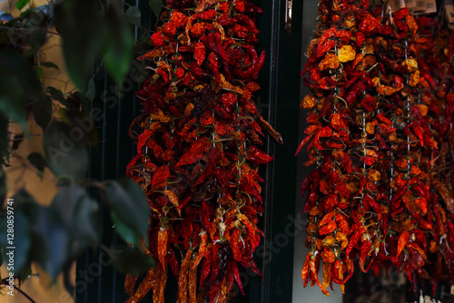 spices red pepper dried hanging in bunches on the street mediterranean cuisine