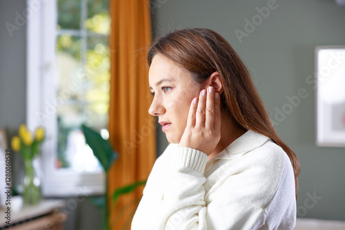 Young woman with ear pain