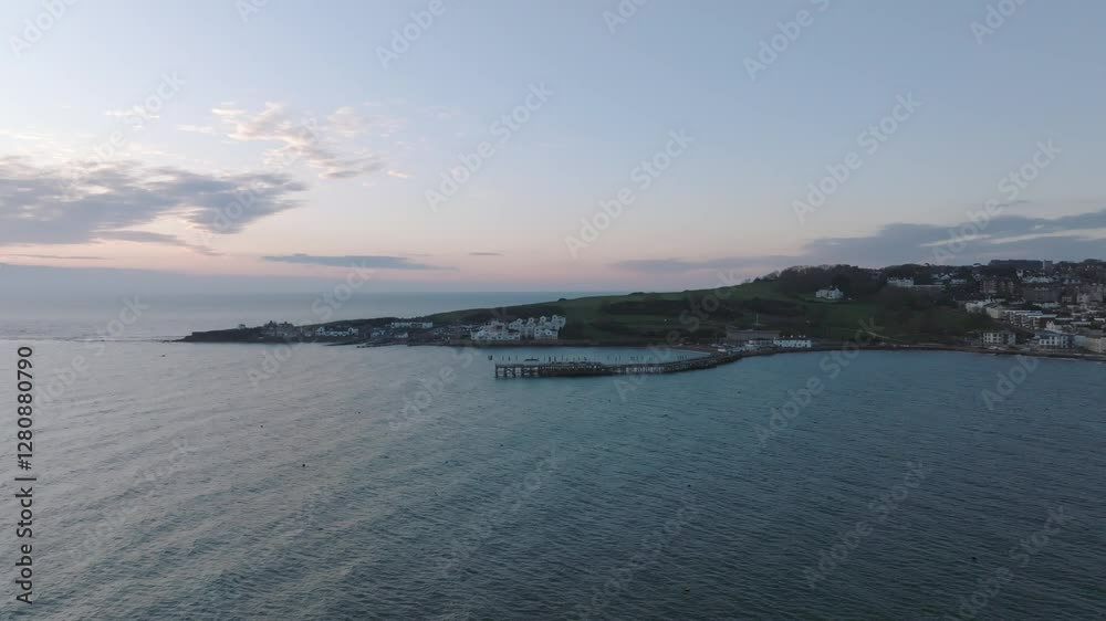 Swanage UK Sunrise flying towards the pier Swanage UK Sunrise flying towards the pier