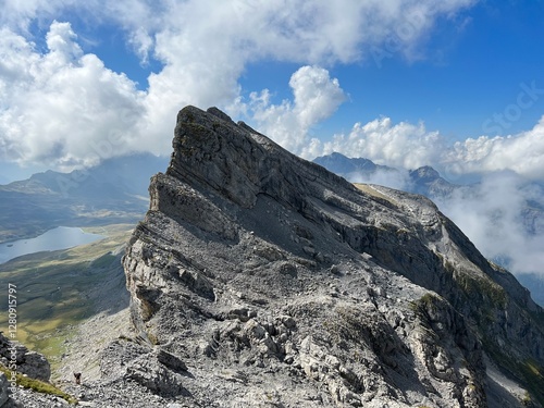 Alpine peaks Chli Hohmad (2492 m) and Gross Hohmad (2307 m) above the Tannensee lake (or Tannen lake) and in the Uri Alps mountain massif, Melchtal - Canton of Obwalden, Switzerland (Kanton Obwald) photo