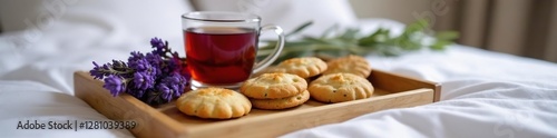 Wooden tray on a bed with tea cookies and fresh lavender bunches, lavender,
