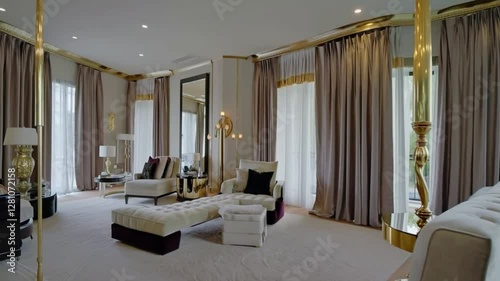 A hotel-inspired master suite with floor-to-ceiling curtains, a chaise lounge, and elegant gold and black accents.