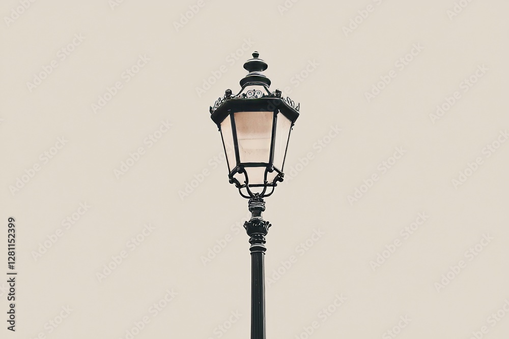 On a white background, an antique black street lamp post is isolated On a white background, an antique black street lamp post is isolated